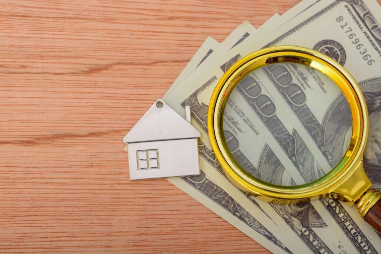 Examining your home property's financial aspects with a magnifying glass